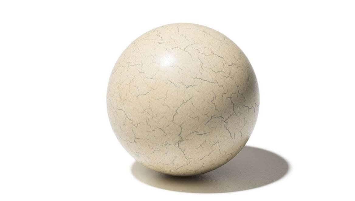 這顆19世紀的撞球由賽璐珞製成，那是早期的塑膠材料，用來取代當時已經開始變得稀少的象牙。MARK THIESSEN, PHOTOGRAPHED AT SMITHSONIAN INSTITUTION, NATIONAL MUSEUM OF AMERICAN HISTORY